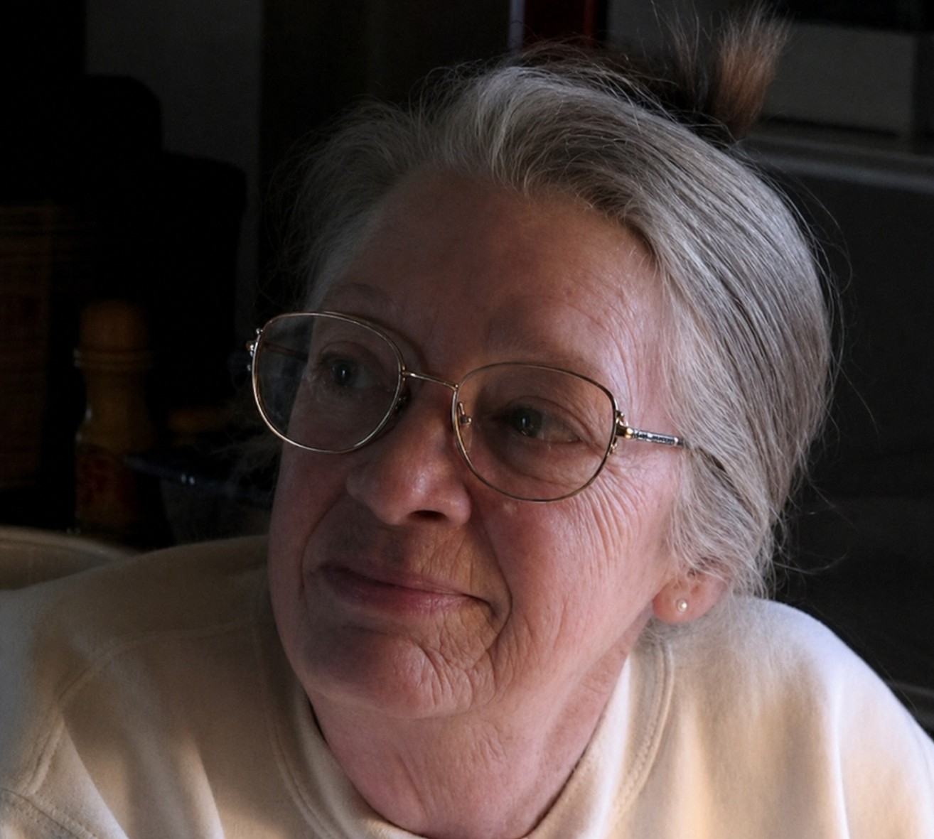 Picture of an elderly widow with glasses