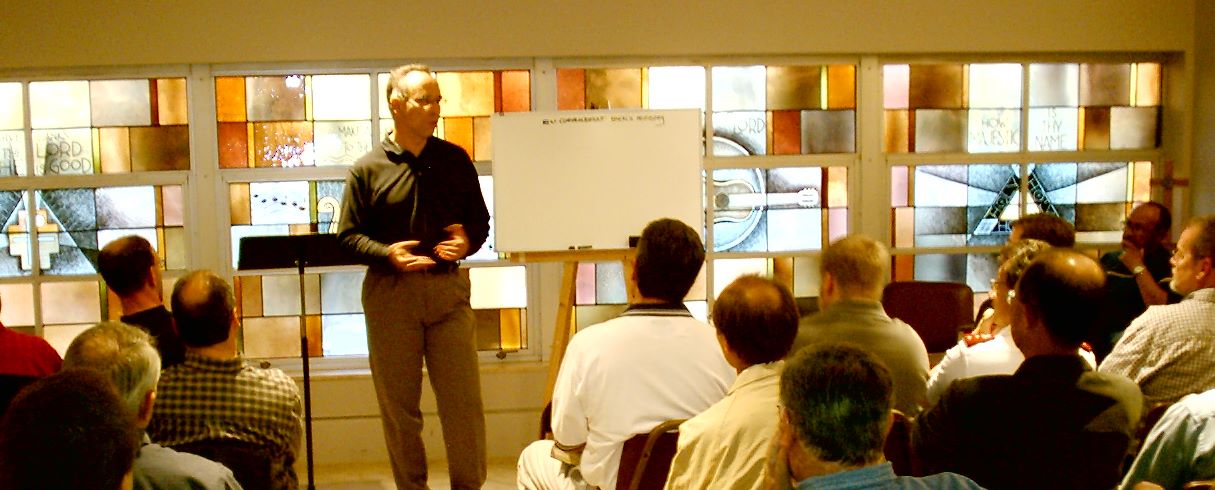 Herb speaking to men.