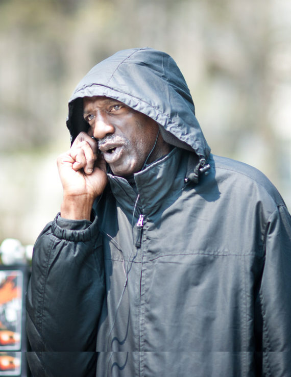 Man on cell phone calling someone.