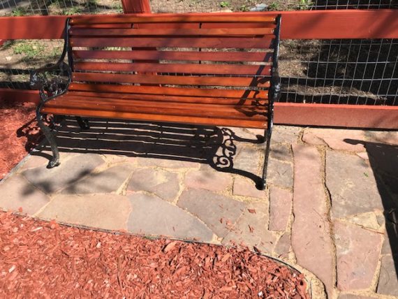 Picture of a bench on a flagstone patio