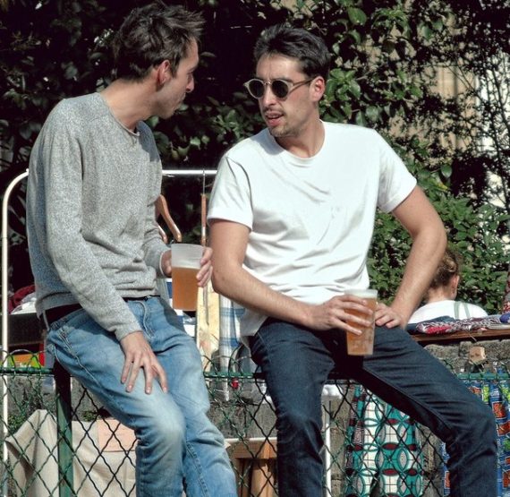 Picture of two men drinking beer.